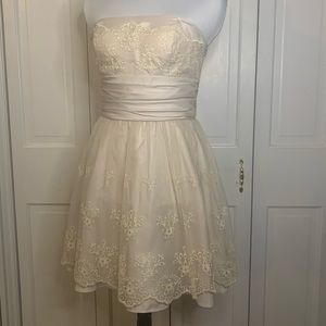 Hailey Logan by Adrianna Papel. Short ivory strapless dress. Size: 5/6
